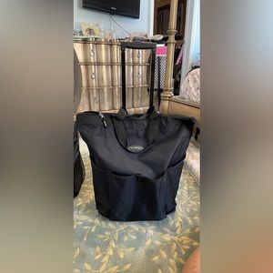 Roller carry on, shopping bag or craft bag. Used once for a weekend get away.